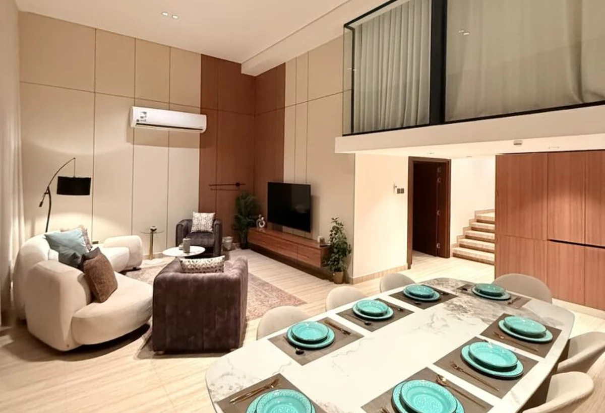 Open-plan living and dining area at Najla Residence apartment 406